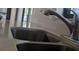 A close-up of a stainless steel kitchen sink with modern faucet and countertops at 820 Coconut Rd, Venice, FL 34293
