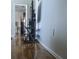 Hardwood floors lead to an open living room space with neutral walls at 820 Coconut Rd, Venice, FL 34293