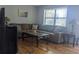 Comfortable living room with cozy seating, bright window, and laminate floors at 820 Coconut Rd, Venice, FL 34293