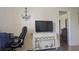 Living room with laminate flooring, TV console, and nautical decor at 820 Coconut Rd, Venice, FL 34293