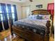 Spacious bedroom with beautiful wood furniture and nautical-themed bedding at 820 Coconut Rd, Venice, FL 34293