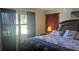 Comfortable bedroom features nautical-themed decor and lots of natural light from the window at 820 Coconut Rd, Venice, FL 34293