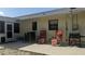 Outdoor patio with seating area, grill, screened room access, and exterior shower for rinsing off at 820 Coconut Rd, Venice, FL 34293