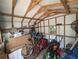 Well organized shed interior with bicycles, lawn equipment, and ample storage space at 820 Coconut Rd, Venice, FL 34293