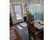 Bright sun room with views to the backyard and access to the outdoors at 820 Coconut Rd, Venice, FL 34293