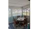Relaxing sunroom with comfortable seating and natural light overlooking the backyard at 820 Coconut Rd, Venice, FL 34293