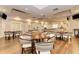 Spacious bar area with tables, chairs, and access to multiple lounge areas at 8556 54Th Avenue E Cir, Bradenton, FL 34211