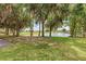 Scenic view of a lush golf course with mature trees and a tranquil pond, perfect for a relaxing game at 8556 54Th Avenue E Cir, Bradenton, FL 34211
