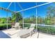 Comfortable screened lanai overlooking pond, perfect for enjoying outdoor living at 8556 54Th Avenue E Cir, Bradenton, FL 34211