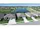 Aerial view of homes by the lake and fountain in this beautiful lakeside community at 8726 Backshore Ln, Parrish, FL 34219