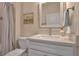 Bathroom featuring a single sink vanity with decorative framed mirror, and neutral wall color at 8726 Backshore Ln, Parrish, FL 34219