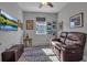Cozy bedroom featuring a ceiling fan, a window for natural light and a comfortable sofa at 8726 Backshore Ln, Parrish, FL 34219