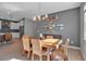 Stylish dining area with a wooden table, decorative accents, and ample natural light at 8726 Backshore Ln, Parrish, FL 34219