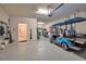 Spacious garage featuring epoxy flooring and a golf cart, offering ample storage and parking at 8726 Backshore Ln, Parrish, FL 34219