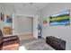 Cozy living room featuring a leather couch, colorful rug, and a TV, perfect for relaxation and entertainment at 8726 Backshore Ln, Parrish, FL 34219