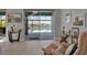 Relaxing living room with waterfront views from the pool and sliding glass doors at 8726 Backshore Ln, Parrish, FL 34219