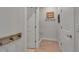 Hallway features a built-in bench with rustic hooks and neutral walls at 8726 Backshore Ln, Parrish, FL 34219