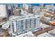 Stunning aerial view of a modern condominium building in a vibrant city setting with ocean views and ample natural light at 111 S Pineapple Ave # 804, Sarasota, FL 34236