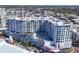 Daytime aerial view of vibrant condo building with pool and surrounding city skyline at 111 S Pineapple Ave # 804, Sarasota, FL 34236