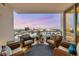 Inviting balcony with comfortable seating and beautiful city views at twilight at 111 S Pineapple Ave # 804, Sarasota, FL 34236