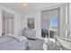 Relaxing bedroom with modern dresser and balcony access with seating, perfect for enjoying the view at 111 S Pineapple Ave # 804, Sarasota, FL 34236
