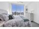 Light-filled bedroom featuring a comfortable bed, city view and neutral color palette at 111 S Pineapple Ave # 804, Sarasota, FL 34236