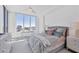 Sunlit bedroom with an oversized window and cityscape view at 111 S Pineapple Ave # 804, Sarasota, FL 34236