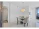 Bright dining area with floor-to-ceiling windows and access to the balcony at 111 S Pineapple Ave # 804, Sarasota, FL 34236