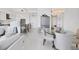 Open-concept floor plan of the dining area, living room and modern kitchen at 111 S Pineapple Ave # 804, Sarasota, FL 34236