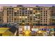 Modern condo exterior view highlights balconies, murals, and architectural details from street level at night at 111 S Pineapple Ave # 804, Sarasota, FL 34236