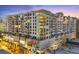 Modern condominium building featuring sleek architecture, ample windows, and private balconies in a vibrant city setting at 111 S Pineapple Ave # 804, Sarasota, FL 34236