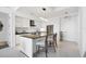 Bright, modern kitchen boasts stainless steel appliances and an island with bar seating at 111 S Pineapple Ave # 804, Sarasota, FL 34236