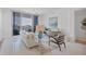 Bright living room with floor-to-ceiling windows and access to the balcony at 111 S Pineapple Ave # 804, Sarasota, FL 34236