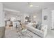 Open-concept floor plan of the living room, dining area and modern kitchen at 111 S Pineapple Ave # 804, Sarasota, FL 34236