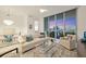 Bright condo living room with city views, modern furniture, and stylish decor at 111 S Pineapple Ave # 804, Sarasota, FL 34236