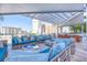 Stylish outdoor lounge area with comfortable seating, a fire pit, and views of the city at 111 S Pineapple Ave # 804, Sarasota, FL 34236