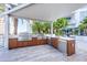 A modern outdoor kitchen with stainless steel grill and ample counter space, perfect for entertaining at 111 S Pineapple Ave # 804, Sarasota, FL 34236