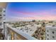 Stunning city view from balcony with cityscape, palm trees, and colorful sky at 111 S Pineapple Ave # 804, Sarasota, FL 34236