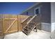 Backyard features privacy fence, stairs to the side entrance, and stone paver patio at 11337 Pineapple Rd, Punta Gorda, FL 33955