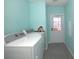 Convenient laundry room with side by side washer and dryer and plenty of space at 11337 Pineapple Rd, Punta Gorda, FL 33955