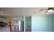 Spacious open-concept living area with modern kitchen, stainless steel appliances, and tile flooring at 11337 Pineapple Rd, Punta Gorda, FL 33955