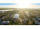 Aerial view of a residential community showcasing the home's location near a lake at 11371 Perico Isle Cir, Bradenton, FL 34209