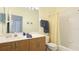 Functional bathroom featuring a vanity with sink, toilet, and a shower/tub combo with a curtain at 11371 Perico Isle Cir, Bradenton, FL 34209