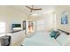 Stylish bedroom with a bed, TV, and glimpses into the kitchen, creating a cohesive living space at 11371 Perico Isle Cir, Bradenton, FL 34209