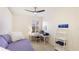 Bright bedroom featuring a daybed, desk, ladder shelf for storage, and ceiling fan at 11371 Perico Isle Cir, Bradenton, FL 34209