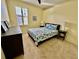 Bedroom features a bright window and coastal-themed decor at 11371 Perico Isle Cir, Bradenton, FL 34209