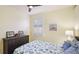 Charming bedroom features a sea-themed decor, plantation shutters, and a dark wood dresser at 11371 Perico Isle Cir, Bradenton, FL 34209