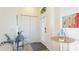 Bright foyer featuring a glass-paneled front door, laminate flooring, and decorative accents at 11371 Perico Isle Cir, Bradenton, FL 34209