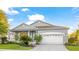 Beautiful home with a well-manicured lawn and a spacious two-car garage at 11371 Perico Isle Cir, Bradenton, FL 34209