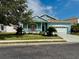 Charming single-Gathering home featuring a well-manicured lawn, attached two car garage and covered front porch at 11371 Perico Isle Cir, Bradenton, FL 34209